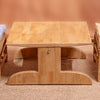 Wooden table with chairs and benches on a plain background