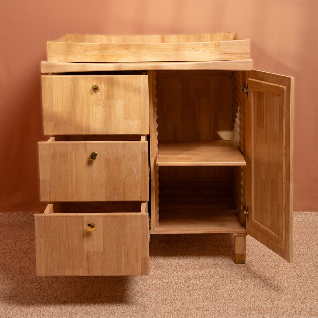 Natural Wooden cabinet with drawers and closet adjustable height changeable knobs, on a beige floor and wall.