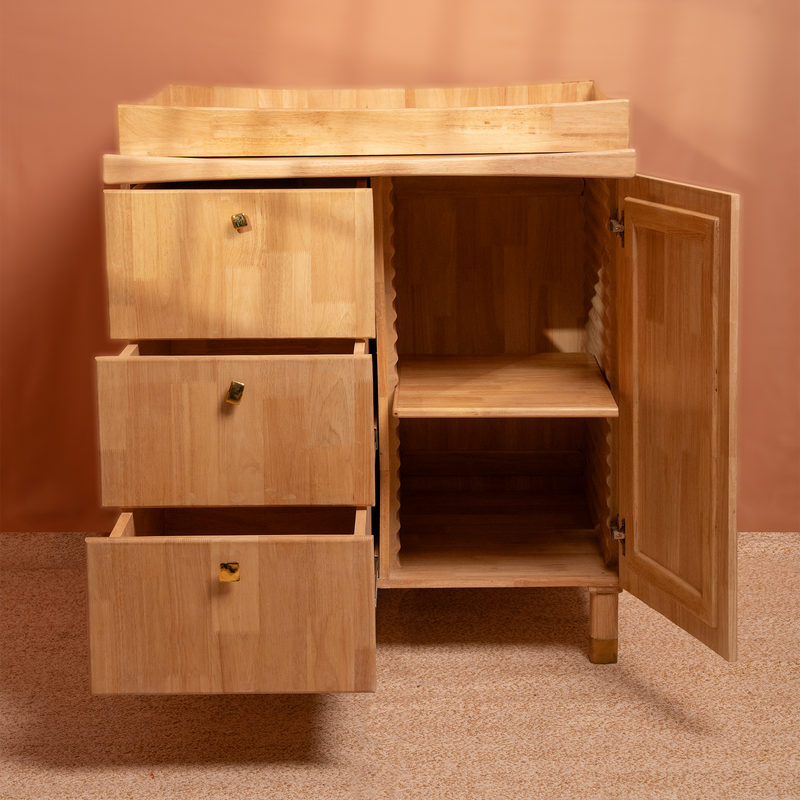 Natural Wooden cabinet with drawers and closet adjustable height changeable knobs, on a beige floor and wall.