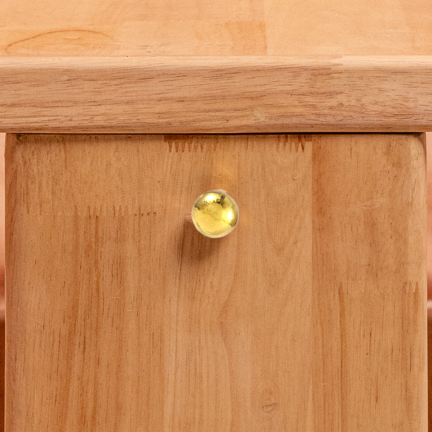 Wooden table with a unique base design on a textured surface