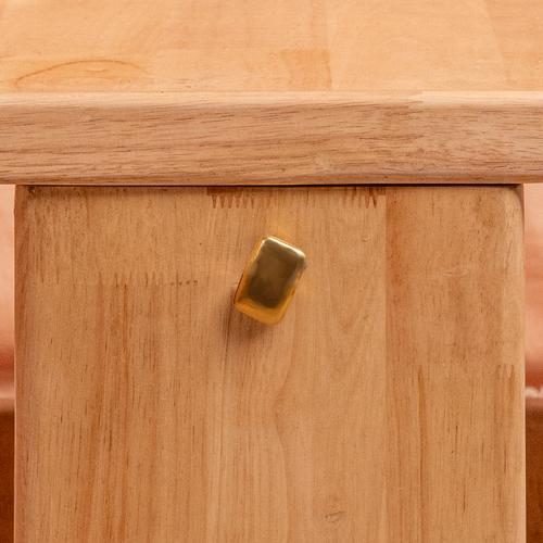 Brass knob on natural wood 