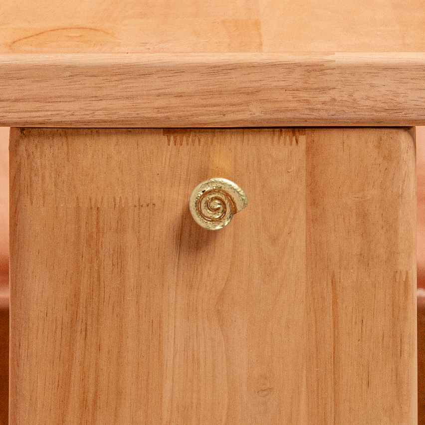 Wooden table with a unique design on a textured surface
